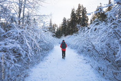Man walking through a cold icy path