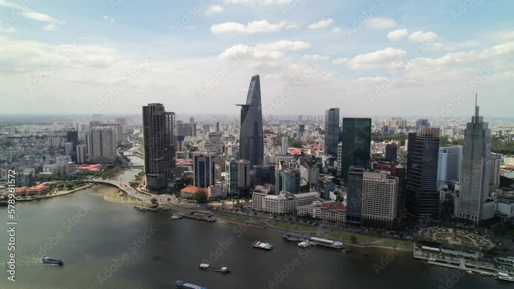 wide aerial panoramic of Ho Chi Minh City modern skyline along the river Saigon river on sunny day wide aerial panoramic of Ho Chi Minh City modern skyline along the river Saigon river on sunny day