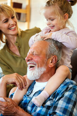 Cheerful multi-generation family having fun while spending time together at home.