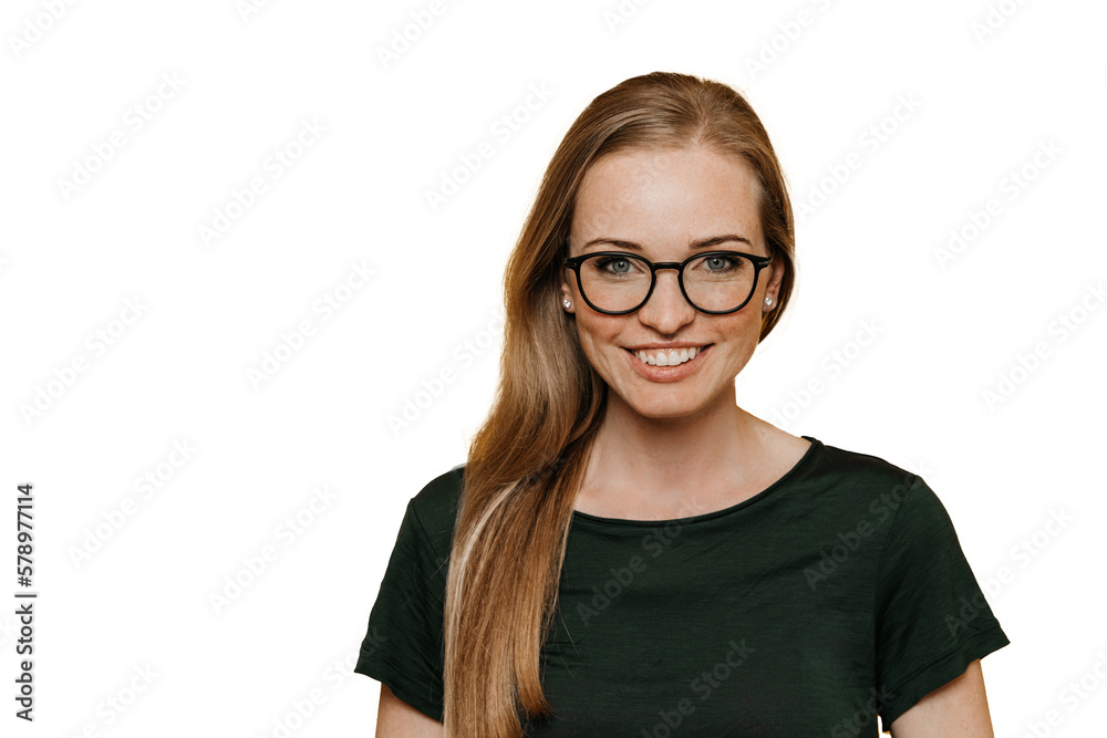 Grateful redhead young woman in glasses toothy smiles looks at camera stands against transparent background. happy American girl satisfied by healthy lifestyle. Mockup, success, purposeful lady.