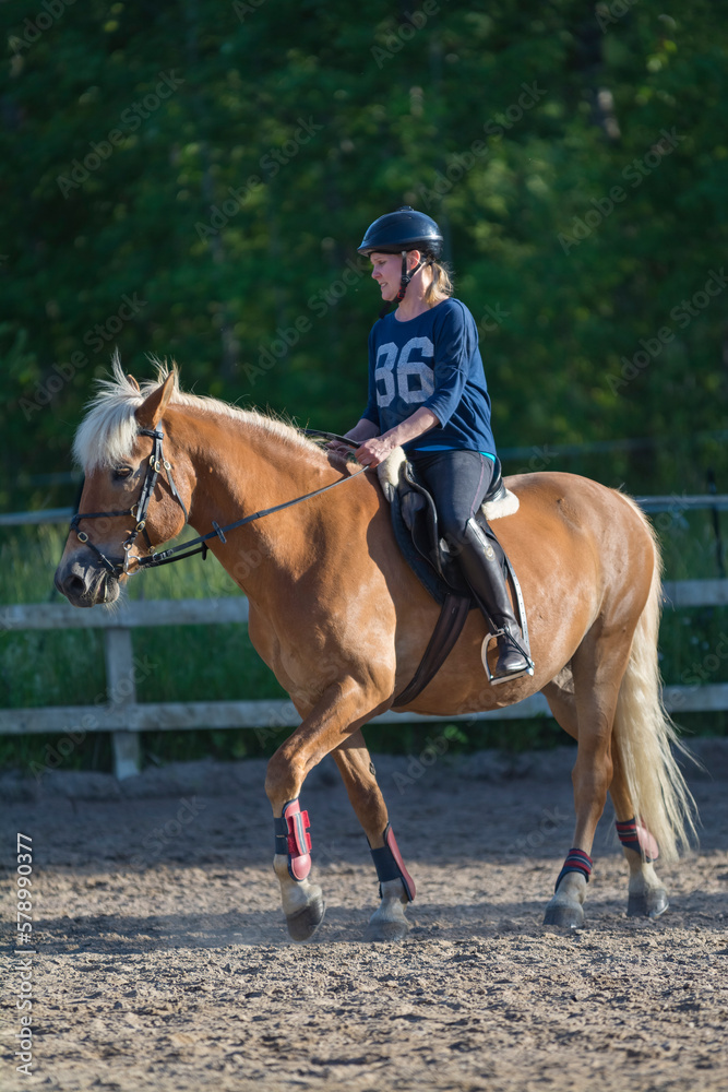 Woman horseback riding 