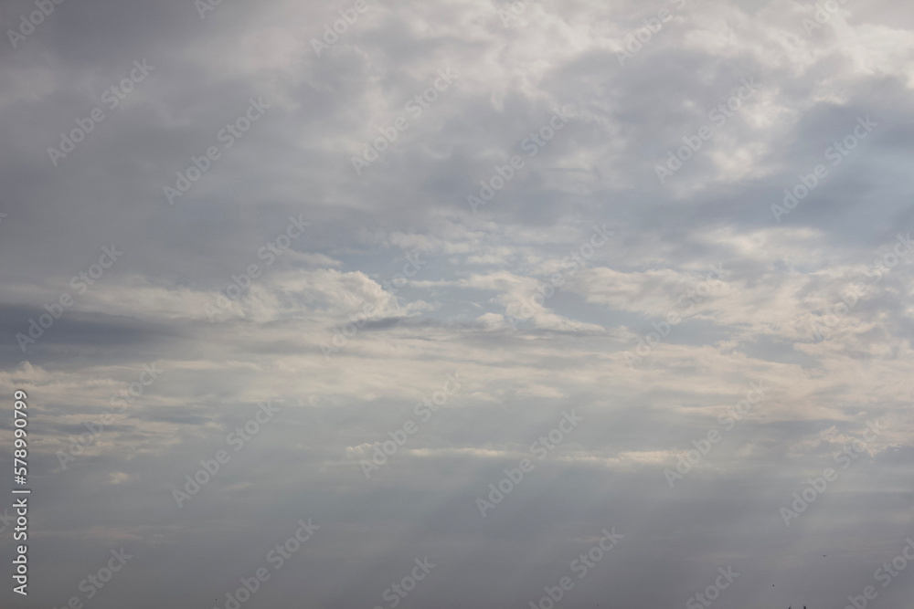 Rainy Clouds. A helicopter in a rainy cloudy sky covering the sun. Clouds Covering Sky.