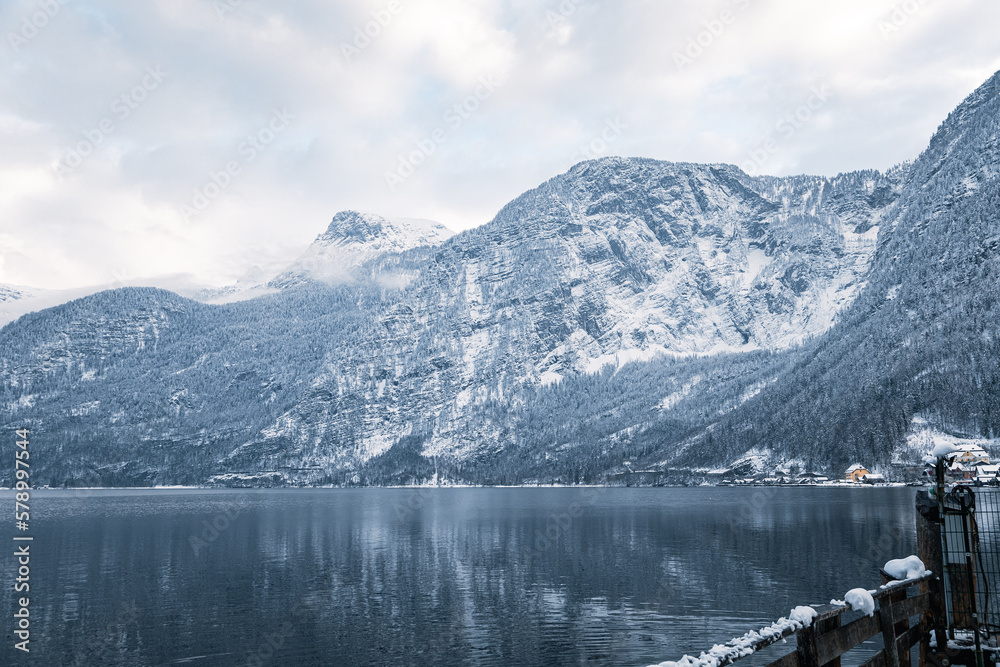 Hallstatt lake and mountains surrounding it on a cloudy day