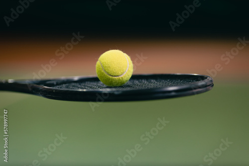 Tennis woman player hold racket and ball at court. © primipil