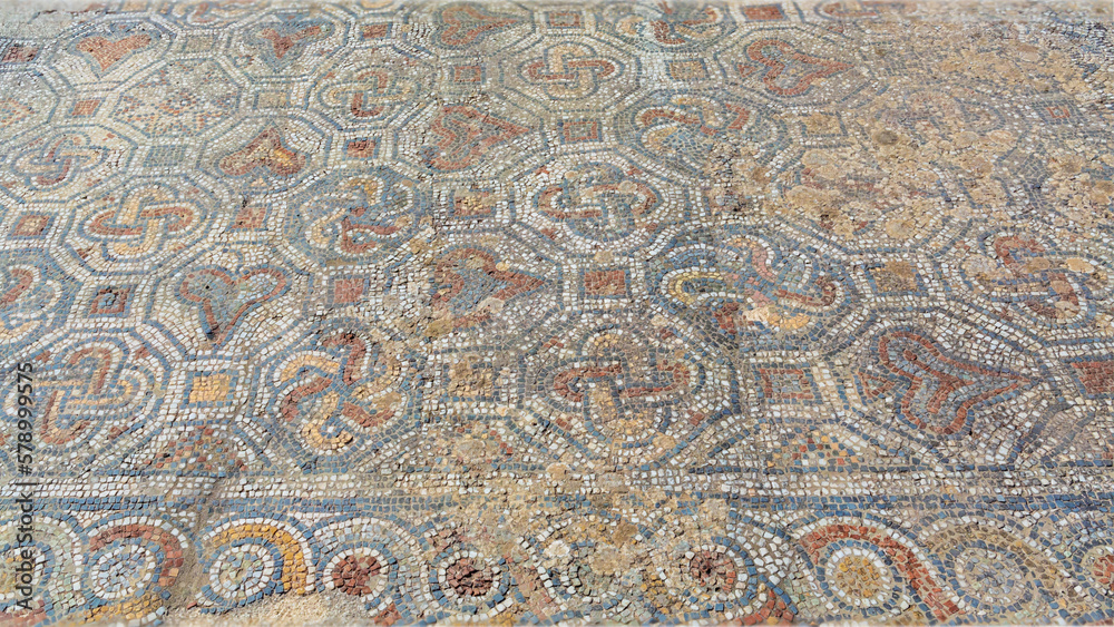 Archaeological remains with decorative tile floors and frescoes paintings in a hillside house on the slopes of the ancient city ruins of Ephesus, Turkey near Selcuk.