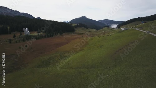 Plateau des Glières with national resistance monument during summer season in Haute-Savoie, France. Aerial forward  photo