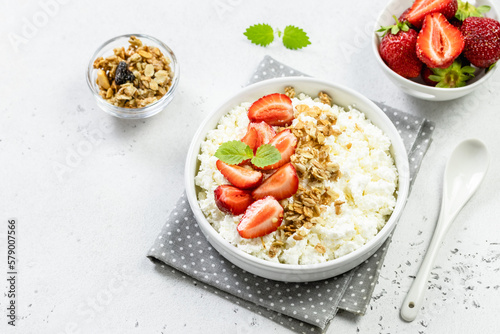 Strawberry granola cottage cheese bowl. Top view, copy space, flat lay.