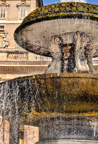 Ancient water fountain made of carved stone