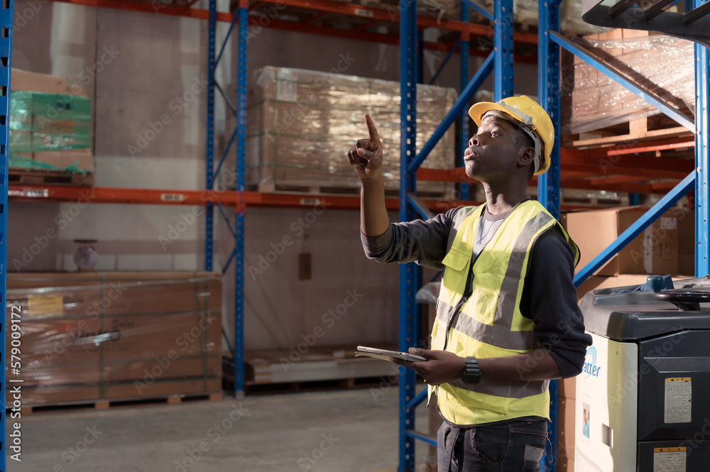 Portrait of warehouse workers in a large warehouse with their own preparation for the day's work Portrait of warehouse workers in a large warehouse with their own preparation for the day's work