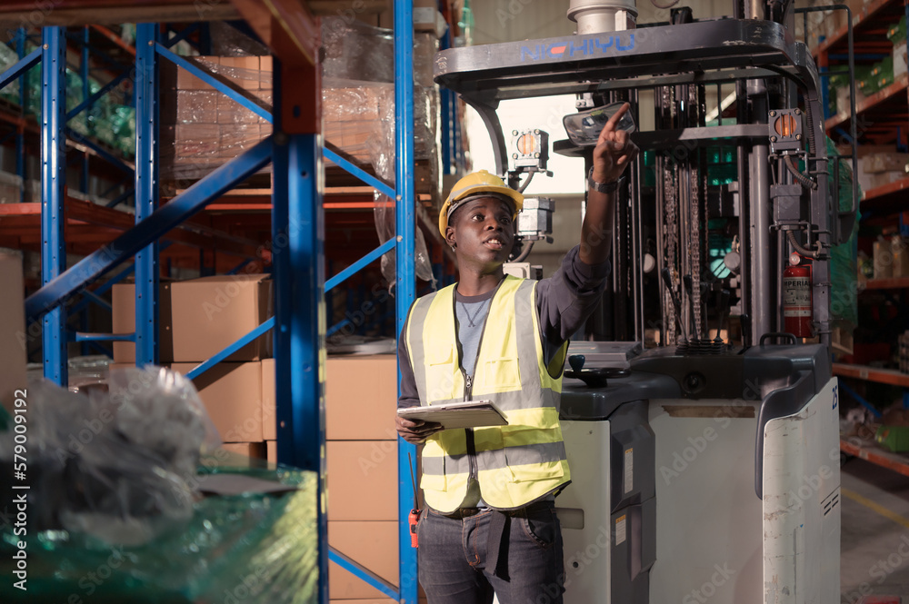 Portrait of warehouse workers in a large warehouse with their own preparation for the day's work