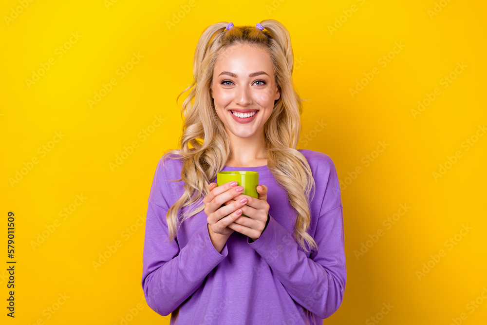 Photo of cheerful funny woman wear violet shirt enjoying tasty beverage isolated yellow color background - obrazy, fototapety, plakaty 