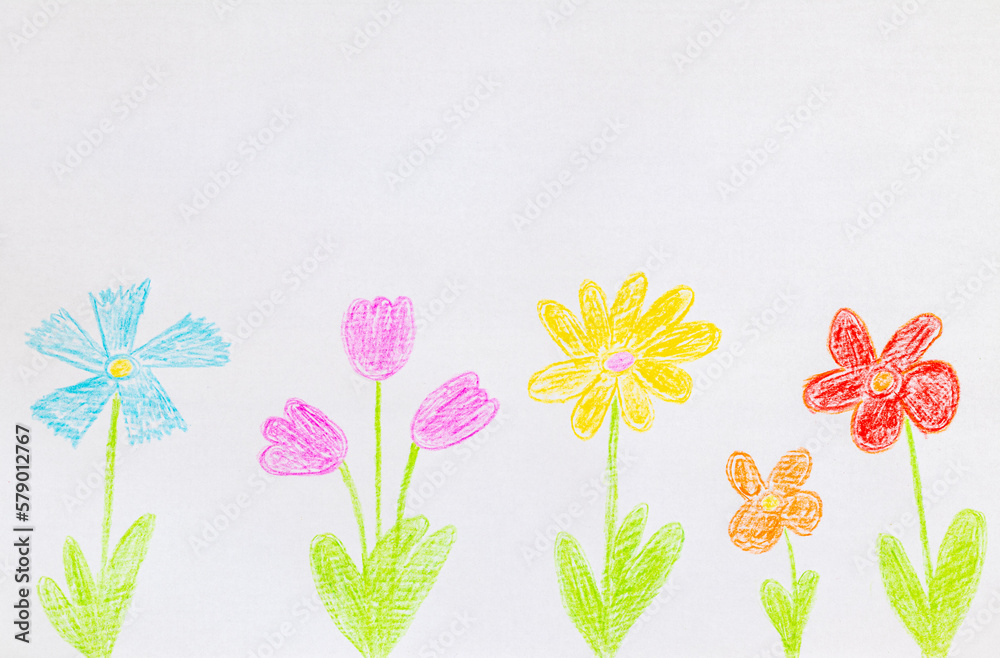 Drawing with colored pencils. Children drawing on a piece of paper. Drawing with colored pencils. Children drawing on a piece of paper.