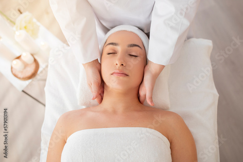 Closeup Shot Of Relaxed Indian Woman Enjoying Neck Massage At Spa