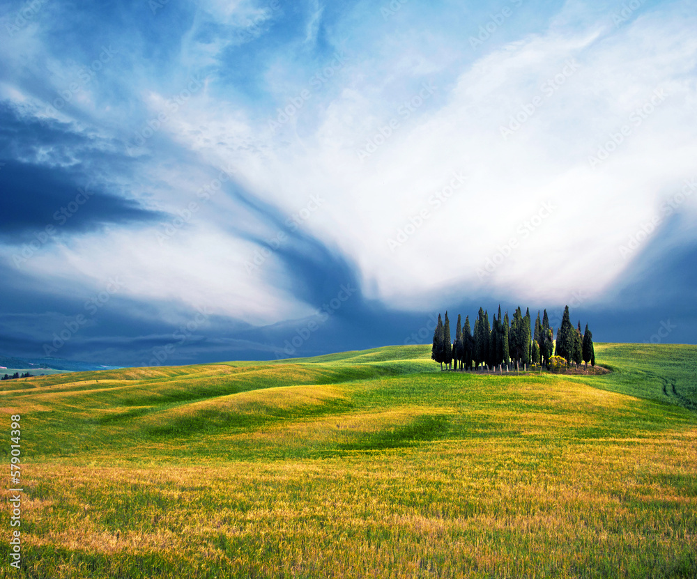 Scenic landscape with hills against clouds in Val d'Orcia, Tuscany, Italy. Wonderful places.