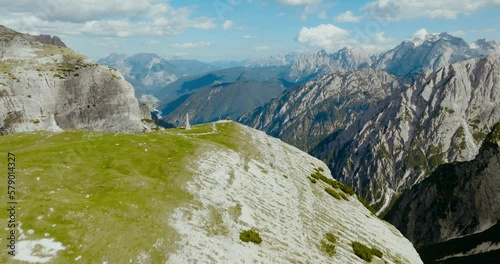 Aerial drone shot of the alps in Dolomites with people in the adge of the rock, Italy, 4k photo