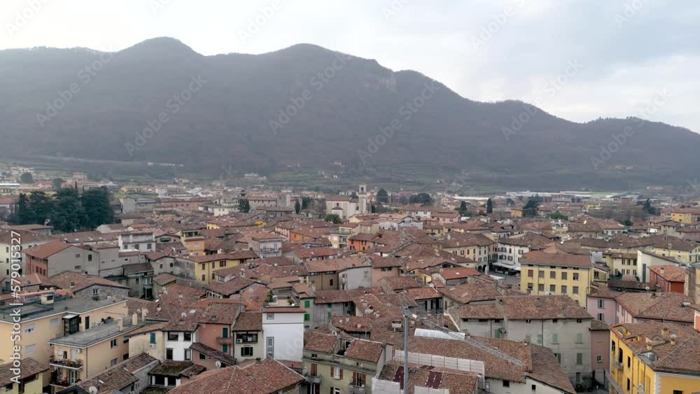 Aerial view italian city of Iseo, mediterranean cityscape bird's eye view flight drone. Village in mountain scenery, historical houses with slate roofs in Italy. Aerial view italian city of Iseo, mediterranean cityscape bird's eye view flight drone. Village in mountain scenery, historical houses with slate roofs in Italy.