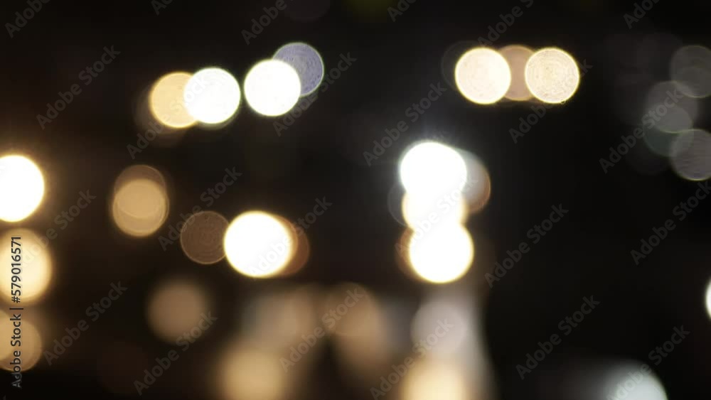 Blurred defocused video of evening car traffic in a big city. Cars in motion and standing in traffic jams. Long exposure exposure and headlight trails Blurred defocused video of evening car traffic in a big city. Cars in motion and standing in traffic jams. Long exposure exposure and headlight trails