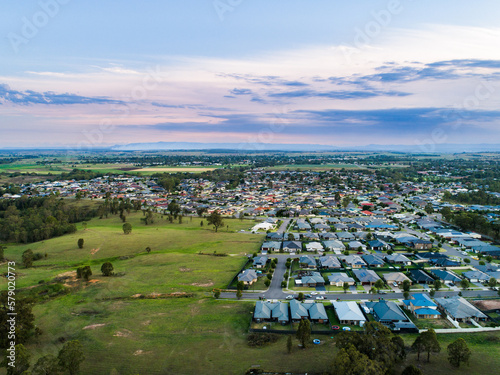 Drone view over edge of suburbia to countryside edge of urban development photo