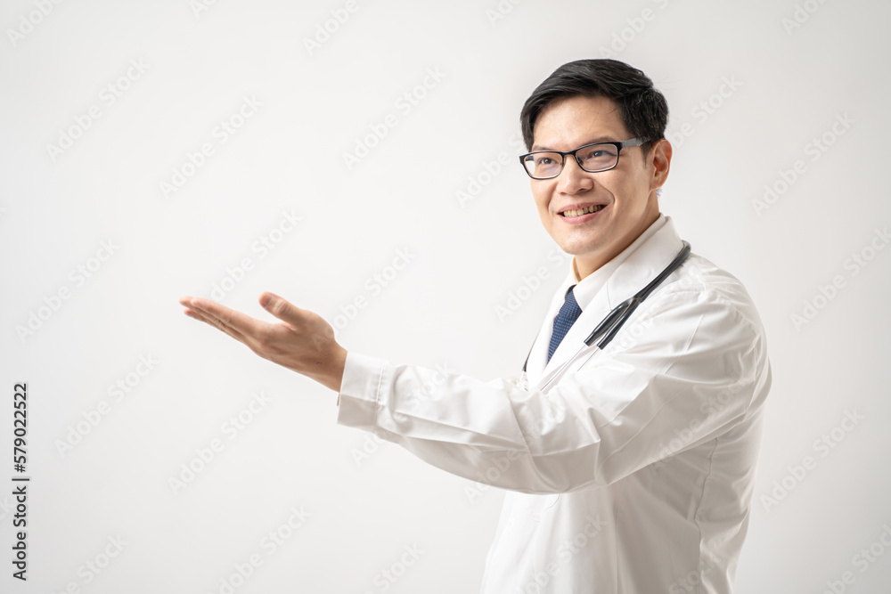 Portrait of confident Asian Doctor in glasses with stethoscope show something isolated on white background Portrait of confident Asian Doctor in glasses with stethoscope show something isolated on white background