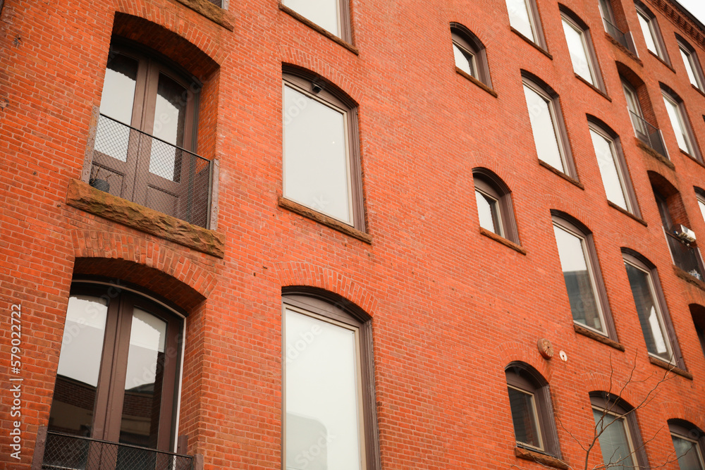 Old brick building apartment and office building in providence rhode island that shows industrial aged factory and architecture with windows 