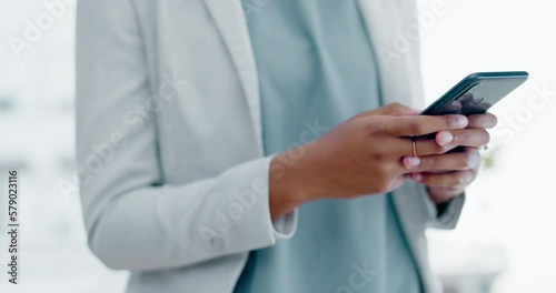 Black woman, hands and phone texting in business for communication, social media or chatting at the office. Hand of African American female typing on smartphone or mobile app for research or chat photo