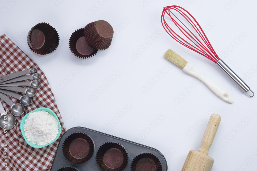 Top view set of kitchen utensils and ingredients for bakery on white background. Materials or kitchen equipment for bakery. Top view set of kitchen utensils and ingredients for bakery on white background. Materials or kitchen equipment for bakery.