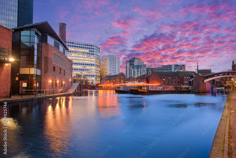 Sunset and brick buildings alongside a water canal in the central Birmingham, England Sunset and brick buildings alongside a water canal in the central Birmingham, England