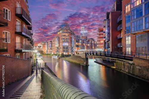 Sunset and brick buildings alongside a water canal in the central Birmingham, England photo