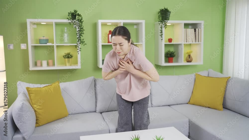 Young Asian woman with COPD experiencing chest pain and tightness