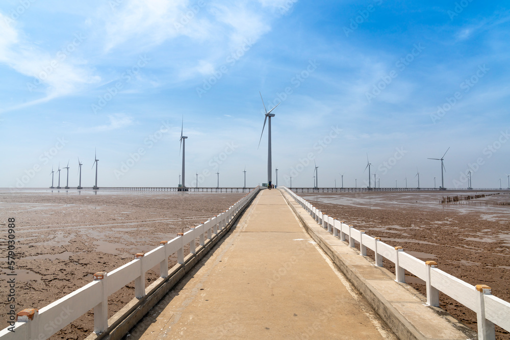 Seascape with Turbine Green Energy Electricity, Windmill for electric power production, wind turbines generating electricity on the sea at Bac Lieu province, Vietnam