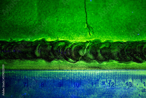 Crack steel butt weld carbon background green contrast magnetic filed fluorescent test