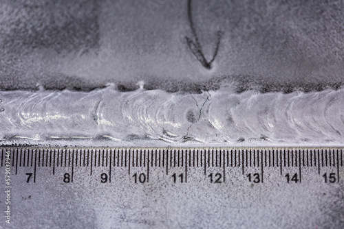Crack steel butt weld carbon background white contrast