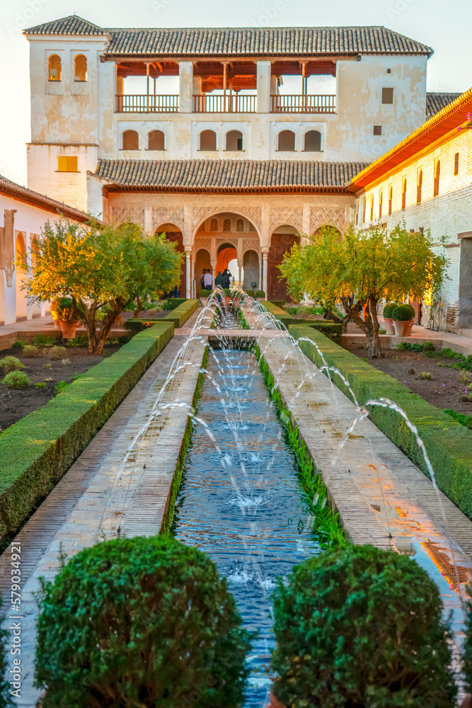 Fountain in green gardens of ancient Alhambra in Granada, Spain on November 26, 2022