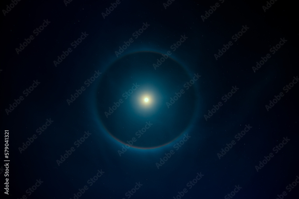 Bright moon with halo on night sky Bright moon with halo on night sky