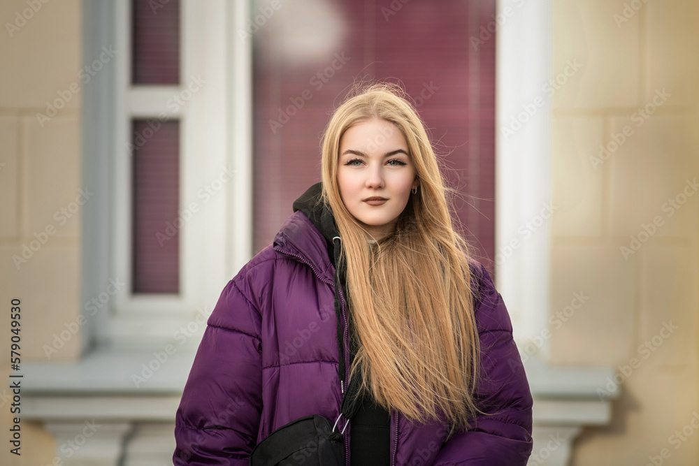 Portrait of a young beautiful fair-haired girl on a spring street. Portrait of a young beautiful fair-haired girl on a spring street.