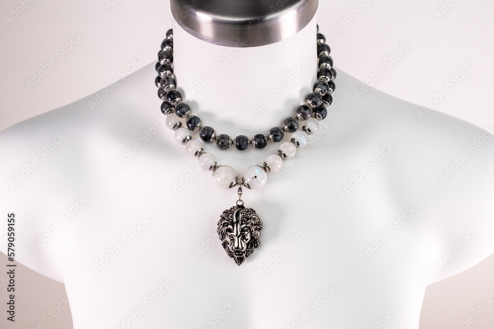 Statement lion head charm necklace on a white mannequin, massive unusual handmade jewelry Statement lion head charm necklace on a white mannequin, massive unusual handmade jewelry
