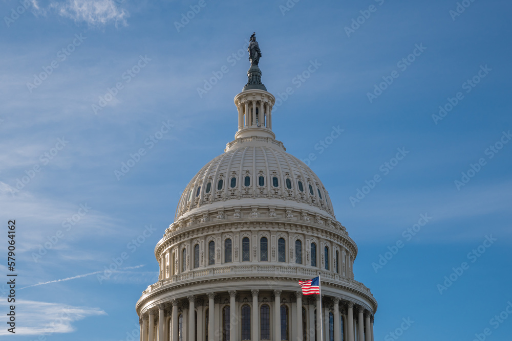 United States Capitol Dome with bright blue sky in background with copy space.