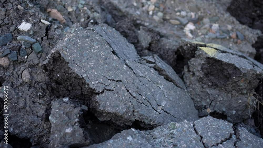 pieces of asphalt after an earthquake or cataclysm close-up pieces of asphalt after an earthquake or cataclysm close-up