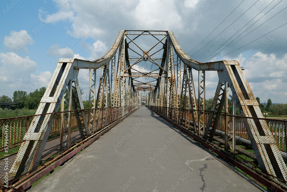 Old metal bridge across Dniester river in the city of Halych, western Ukraine Old metal bridge across Dniester river in the city of Halych, western Ukraine