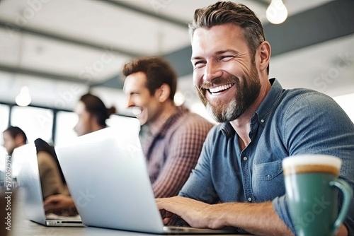 Cheerful and contented young Caucasian man sitting at desk and using laptop with a smile appears to be engaged and focused on his work. Generative AI