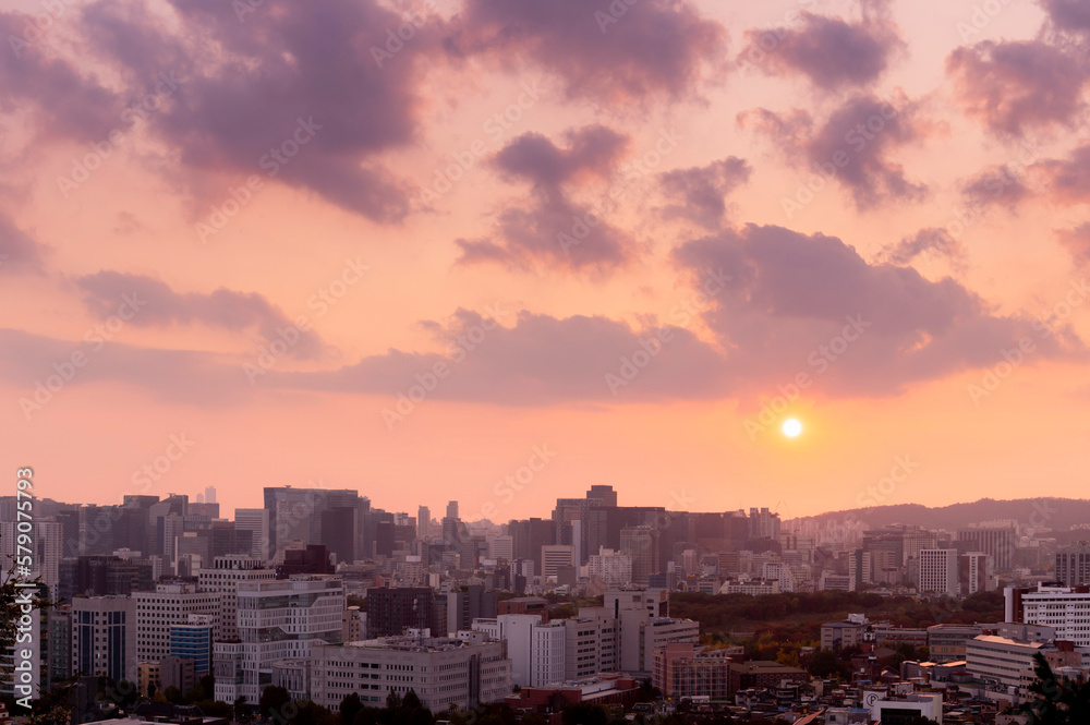 pink sweet sunset of Seoul cityscapes with high rise office buildings and skyscrapers in Seoul city, Republic of Korea in winter blue sky and cloud