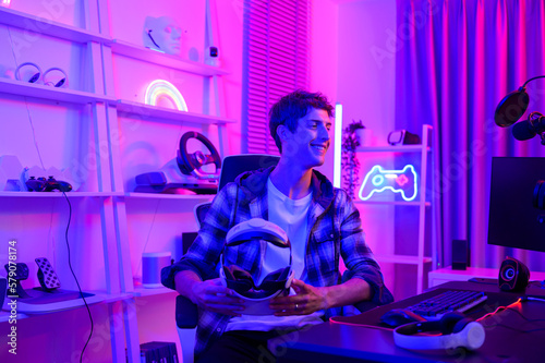 Young Caucasian man Pro Gamer have live streaming  playing video game   using virtual reality glasses at home
