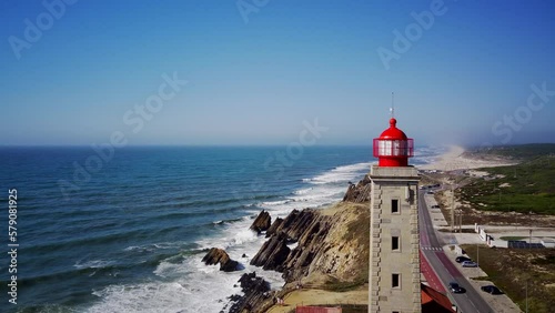 Penedo da Saudade lighthouse and rocky coastal cliff on São Pedro De Moel photo