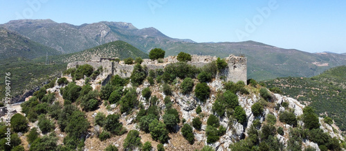 Castle on top of the mountain: Karitena Castle in historic town of Karitena on Peloponnes in Greece. Small village in the Highlands of Arcadia photo