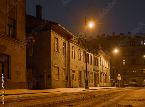 the light of lanterns on the winter night streets of Riga 1