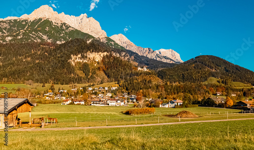 Alpine autumn or indian summer view with horses near Saalfelden am Steinernen Meer, Salzburg, Austria