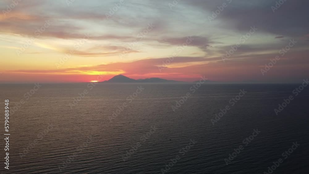 Incredible sunset scenery in Greece. Flying into the sunset. View to island of Kefalonia. Shot in Kyllini Beach. Incredible sunset scenery in Greece. Flying into the sunset. View to island of Kefalonia. Shot in Kyllini Beach.