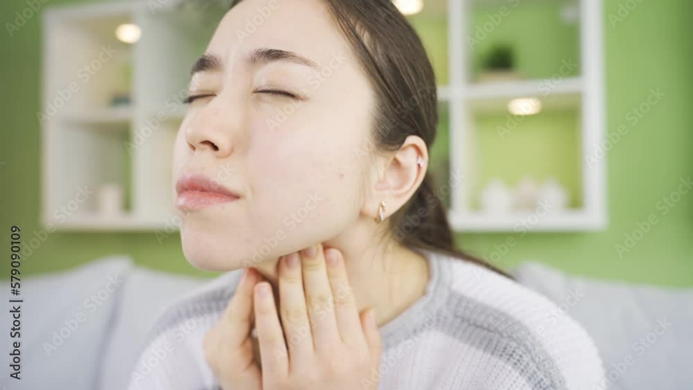 Young Asian woman with sore throat. Flu.
Young asian woman suffering from flu and cold sore throat.
Young Asian woman with sore throat. Flu.
Young asian woman suffering from flu and cold sore throat.