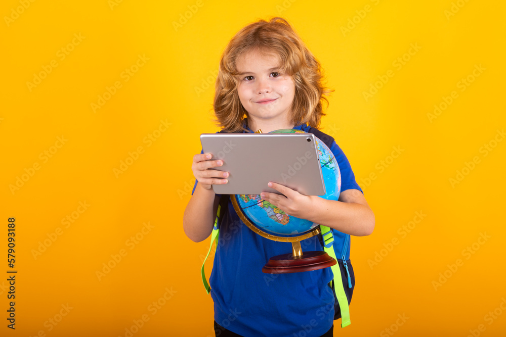 School boy world globe and tablet. School kid student learning, study language or literature at school. Elementary school child. Portrait of nerd pupil studying. School boy world globe and tablet. School kid student learning, study language or literature at school. Elementary school child. Portrait of nerd pupil studying.