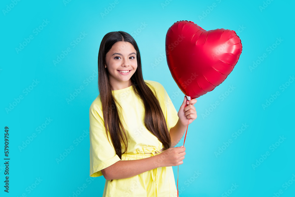Happy girl face, positive and smiling emotions. Portrait of child teenage girl with heart balloon. Valentines day concept. Excited face, cheerful emotions of teenager girl. Happy girl face, positive and smiling emotions. Portrait of child teenage girl with heart balloon. Valentines day concept. Excited face, cheerful emotions of teenager girl.